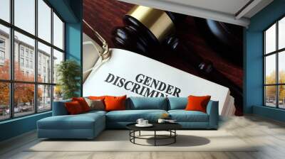 Book with chapter gender discrimination and a gavel. Wall mural