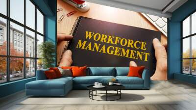 Book with name workforce management in an office. Wall mural