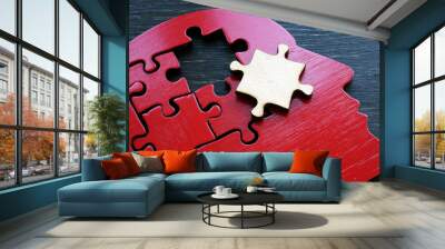 Brain problems or mental illness. The shape of a human head with a puzzle piece. Wall mural