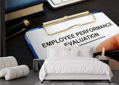 Clipboard with employee performance evaluation and pen. Wall mural