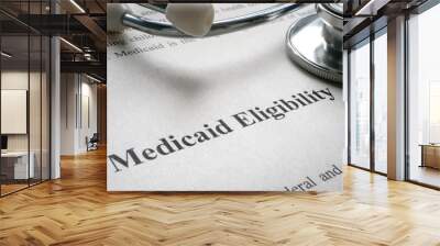 Info about Medicaid eligibility and medical stethoscope. Wall mural