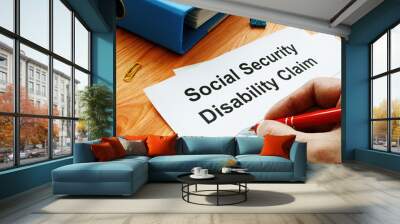 Man filling in Social Security Disability Claim. Wall mural