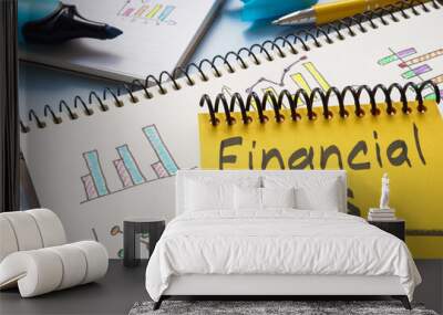 Notebook with financial goals on a table. Personal finance planning. Wall mural