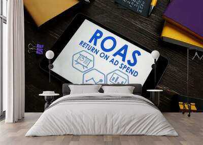 ROAS Return on Ad Spend report on a tablet. Wall mural