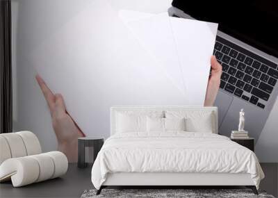 woman with a book, magazine and laptop on a white background. student. business. mockup Wall mural