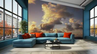 Clouds over the sea at sunset light. Wall mural