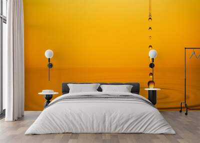 Golden Oil Drops on Yellow Background. Wall mural