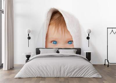 Blue-eyed baby under white towel Wall mural