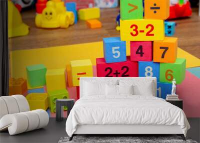 child kid colorful education toys cubes with numbers math pattern background on the bright background. Flat lay. Childhood infancy children babies concept. Wall mural