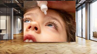 treatment, using therapeutic, medical eye drops for a child with conjunctivitis Wall mural