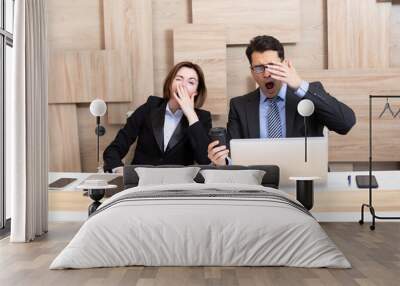 Sleepy business people yawning and going to siesta working in the office Wall mural