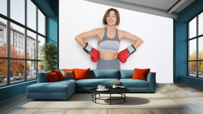 Young and attractive woman in boxing gloves posing isolated on white background	 Wall mural