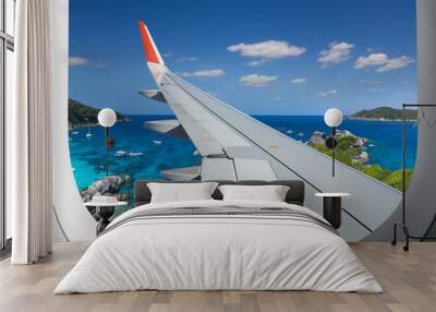 View from airplane. Flight window. Vacation destinations. Tropical beach. Travel concept. Wall mural