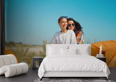 LGBT lesbian couple love moments together during travel vacation. Authentic people portrait concept Wall mural