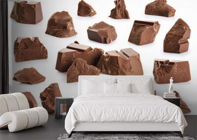 Pieces of milk chocolate isolated on white background. Wall mural