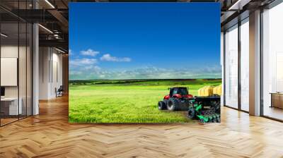 Tractor working in the field. Wall mural