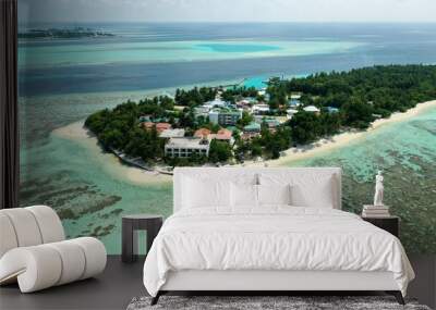 Bird's eye view of tropical islands in the ocean. View of the islands from a drone. Maldives, Thinadhoo (Vaavu Atoll), Dhigurah Wall mural