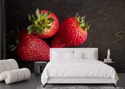 A close up of strawberries on a wooden table. Wall mural