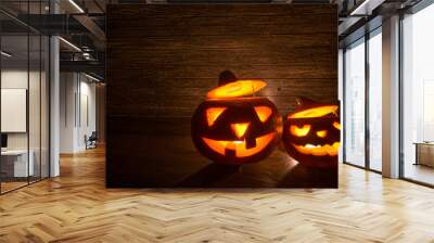 Two Halloween Pumpkins on Old Wood as Retro background. Wall mural