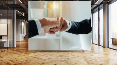 Partnership. two businessman investor hand to fist bumping and joining hands together after complete business deal in meeting room at home office, teamwork cooperate, negotiation and financial concept Wall mural