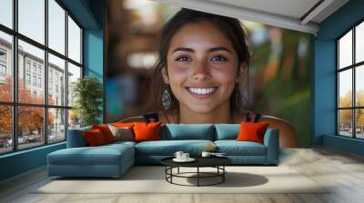 A beautiful Chilean woman. Chile. A beautiful Chilean woman. A young woman with a warm smile poses happily in a vibrant, tropical setting, showcasing a sense of joy and relaxation.  #wotw Wall mural