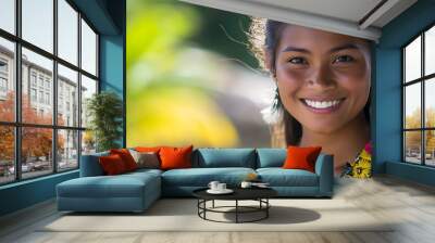 A beautiful Palauan woman. Palau. A beautiful Palauan woman. A cheerful young woman with a radiant smile is adorned in colorful floral accessories, set against a lush, tropical backdrop. . #wotw Wall mural