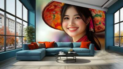 A beautiful Vietnamese woman. Vietnam. A beautiful Vietnamese woman. A joyful young woman wearing a colorful traditional hat and vibrant clothing smiles radiantly in a lively outdoor setting. . #wotw Wall mural