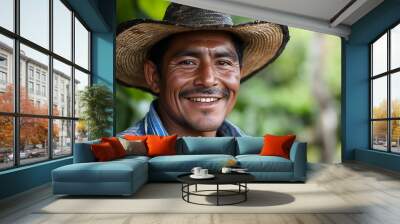 A handsome Salvadoran man. El-Salvador. A smiling man wearing a straw hat and a colorful striped shirt is posed against a lush green background, conveying warmth and approachability. . #motw Wall mural