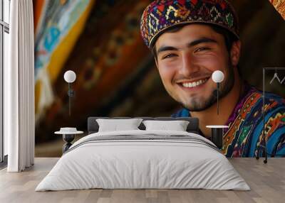 A handsome Uzbek man. Uzbekistan. A cheerful young man wearing traditional colorful attire smiles warmly in a vibrant cultural setting. . #motw Wall mural