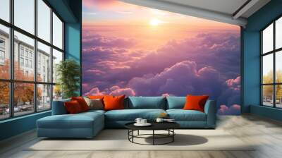 Pink and orange clouds flying above the clouds at sunset or sunrise Wall mural