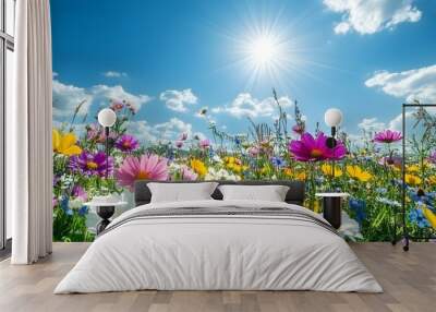 Vibrant flower field under sunny sky  Wall mural