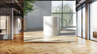 White mug for mockups. A clean, white coffee mug sits on a wooden table in a bright, airy room with natural light and greenery in the background. Wall mural