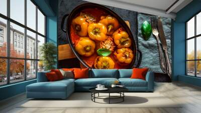 Pepper stuffed with minced meat and rice in tomato sauce. Wall mural