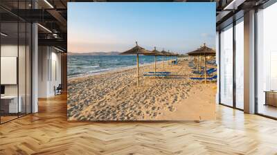 Straw umbrellas on sandy beach of Marmari. The Greek island of Kos Wall mural