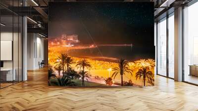 Bonfires festival on the beach of Mediterranean Sea in Valencia, Spain is a traditional Spanish festival that brings thousands of people to the beach to make fire and spend time with family and friend Wall mural