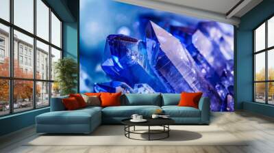 A close-up of gleaming blue crystals, showcasing their intricate structure and vibrant hues, evoking elegance and nature's beauty. Wall mural