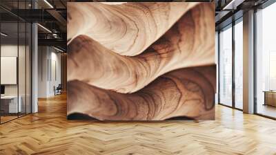 A close-up shot of undulating wooden textures, displaying the stunning natural patterns and flowing, sculpted details of expertly crafted woodwork. Wall mural