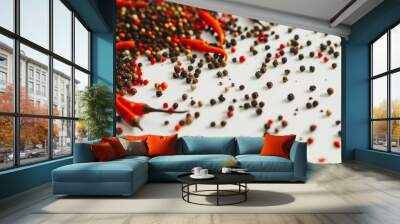 An artistic close-up of colorful peppercorns and red chili peppers scattered on a white surface, emphasizing texture and vibrancy. Wall mural