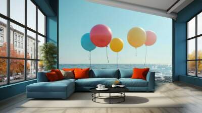 Colorful balloons floating gently above the sand with an ocean backdrop, symbolizing freedom, celebration, and carefree joy. Wall mural