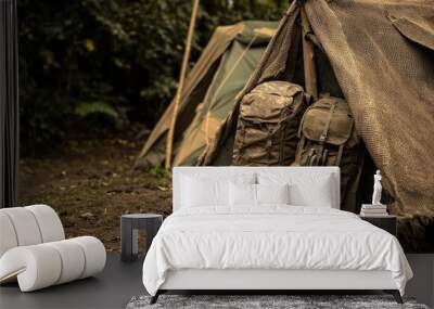 Army Camp. Built Barracks with Camouflage Backpacks in Footed Burlap Campsite Wall mural