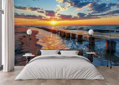 Baltic Sea Sunset: Beach, Old Wooden Breakwater, Seascape View Wall mural