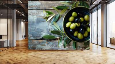 Black and Green Olives on Painted Wooden Background. Aromatic Berry in a Bowl Wall mural