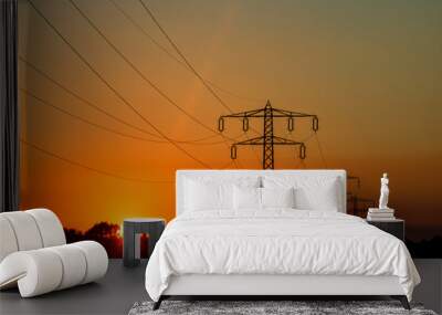 Electric power pylon, electric tower at sunset Wall mural