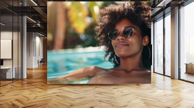 black woman relaxing in spa pool at luxury resort Wall mural