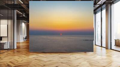 Beautiful view of a sunset with different colors over the s Wall mural