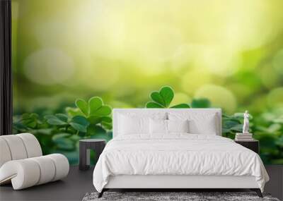 Patricks Day. Lucky Irish Four Leaf Clover among Shamrocks on Green Background Wall mural