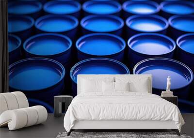 Rows of Blue Metal Barrels in Industrial Setting with Dramatic Lighting Wall mural