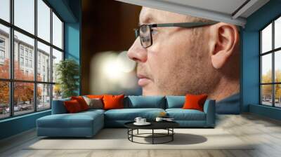 Side view portrait of a man with glasses Wall mural