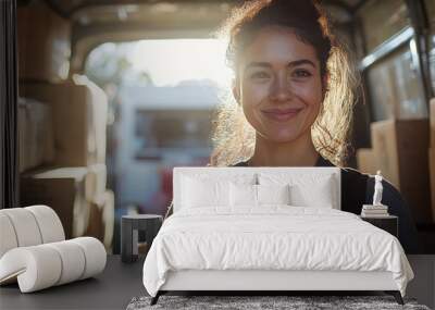 Smiling Delivery Woman Inside Van with Sunlight and Brown Boxes Wall mural