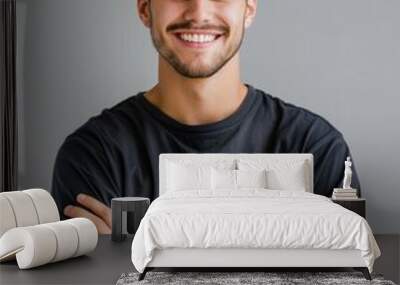 Young Man Portrait. Handsome Smiling Man with Folded Arms in Studio Shot Wall mural